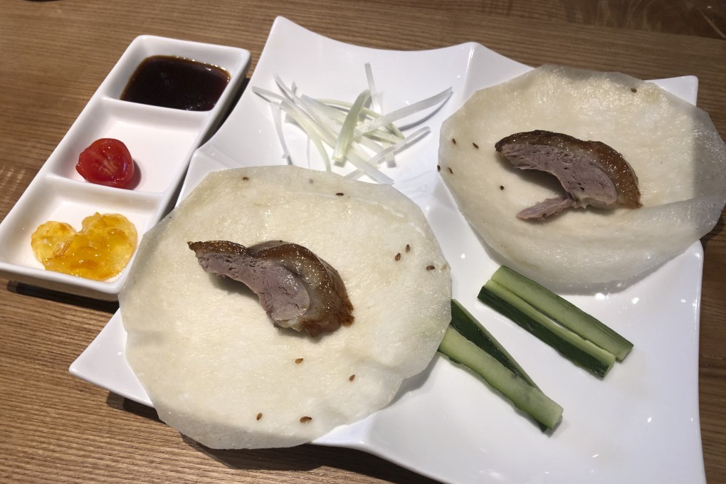 Peking duck with paper-thin pancakes, scallion, cucumber strips and traditional Beijing sauce from The Northern Kitchen. Photo: Jane Zhang