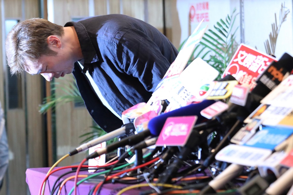 Andy Hui bows in apology to his wife, family and fans at a press conference on April 16, after a video captured by an on-board camera allegedly showed him getting intimate in a vehicle with TVB actress Jacqueline Wong. Photo: Felix Wong