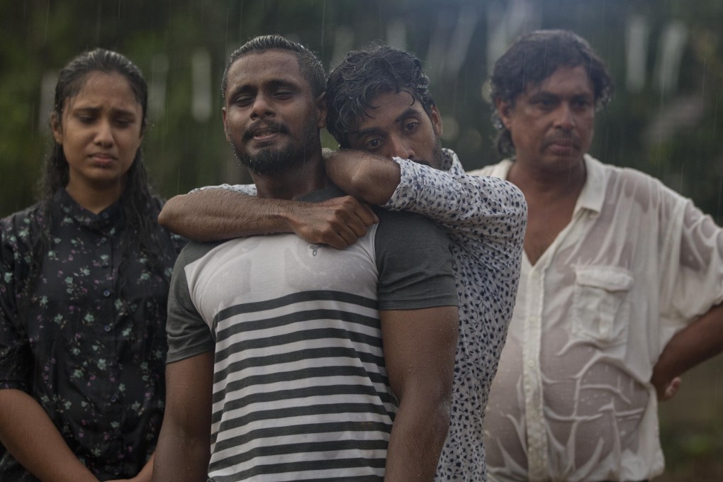 Mourners grieve at the burial of three members of the same family victims of Easter Sunday bomb blast at St. Sebastian Church in Negombo. Photo: AP