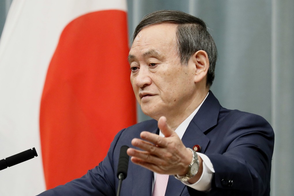 Japanese Chief Cabinet Secretary Yoshihide Suga holds a press conference in Tokyo. Photo: Kyodo