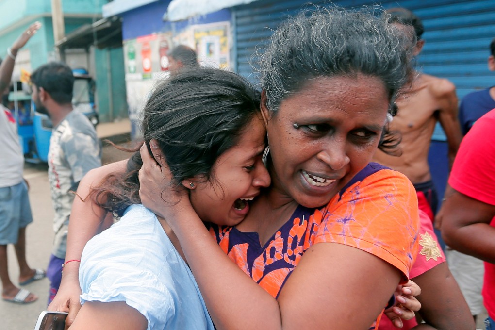 People leave their houses in fear as the military try to defuse a suspicious van in Colombo. Photo: Reuters