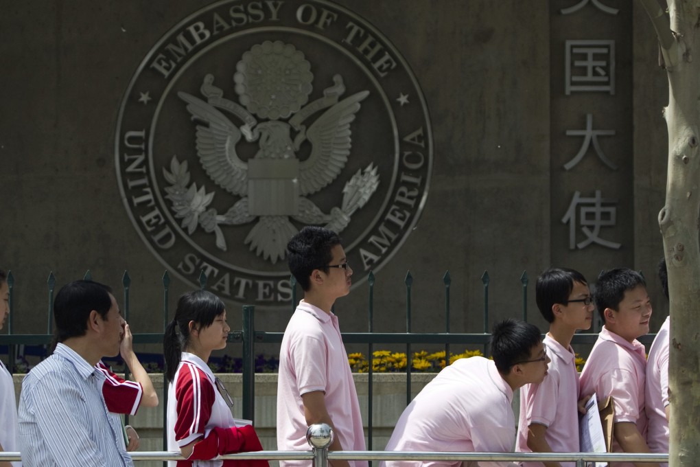 Chinese students wait outside the US Embassy for visa interviews. Photo: AP