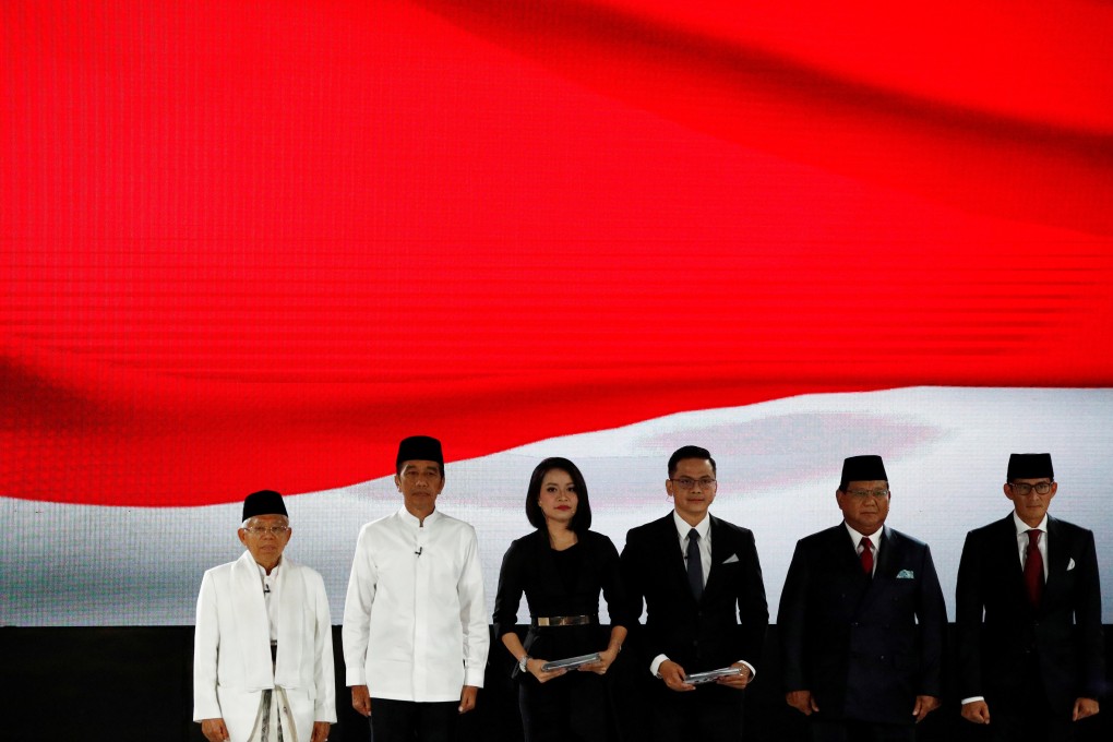 Indonesia's President Joko Widodo (second from left) and his running mate Ma'ruf Amin (left) sing the national anthem with presidential candidate Prabowo Subianto (second from right) and his running mate Sandiaga Uno (right) before the last presidential debate in Jakarta on April 13. Photo: Reuters