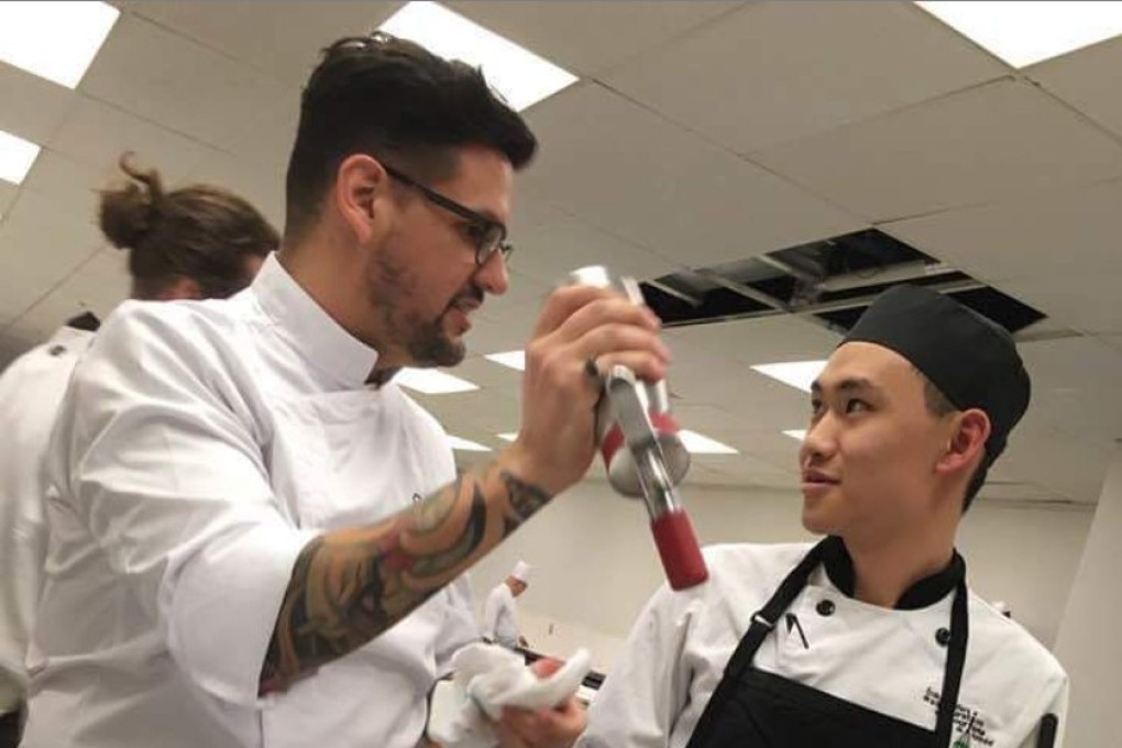 Twenty-year-old chef Andersen Lee (right) learns to make garlic bread. Photo: Andersen Lee