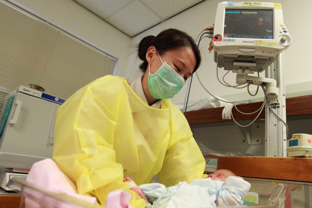A nurse takes care of a baby at the neonatal intensive care unit at United Christian Hospital, Kwun Tong. Photo: May Tse