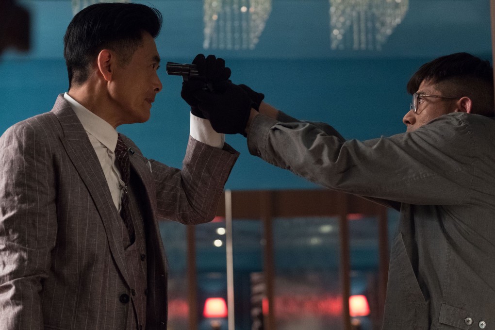 Chow Yun-fat (left) and Aaron Kwok in a scene from Project Gutenberg, a successful co-production which was awarded best movie at the Hong Kong Film Awards earlier this month.