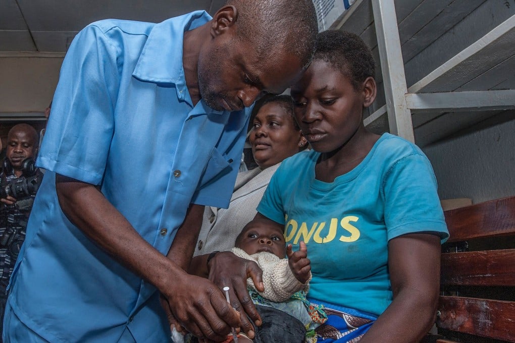 A health surveillance assistant gives a dose of the malaria vaccine to the first recipient on Tuesday at Mitundu Community Hospital in Lilongwe. Photo: AFP