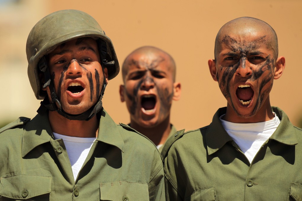 Fighters from the self-proclaimed Libyan National Army loyal to Khalifa Hifter attend their graduation ceremony at a military academy in Libya's eastern city of Benghazi. Photo: AFP
