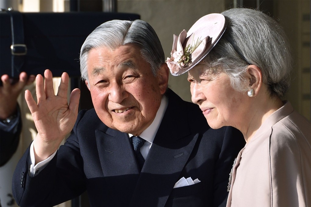 Japan's Emperor Akihito (left) waves to well-wishers alongside his wife Empress Michiko. Photo: AFP