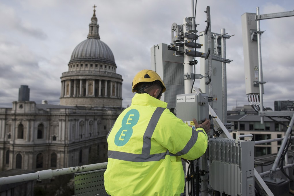 An engineer checks 5G masts and Huawei equipment during trials in London. Photo: Bloomberg
