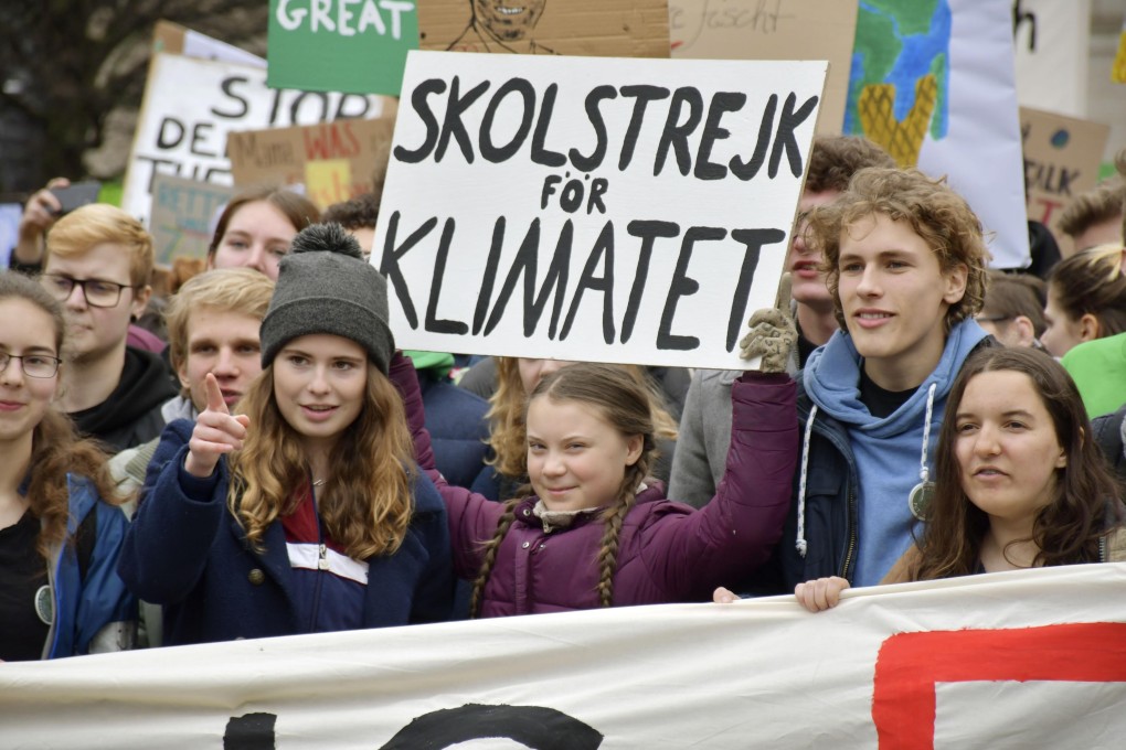 Swedish teen activist Greta Thunberg (centre) and other protesters take their climate change demonstration to Berlin on March 29. Thunberg, who became famous for initiating the “school strike for climate” movement that spread to nearly 100 countries, has been nominated for a Nobel Peace Prize. Photo: Kyodo