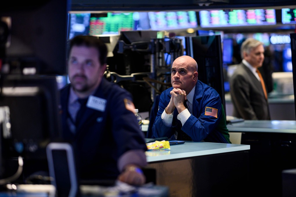 A trader is seen ahead of the closing bell on the floor of the New York Stock Exchange on March 18, 2019 in New York. Photo: AFP