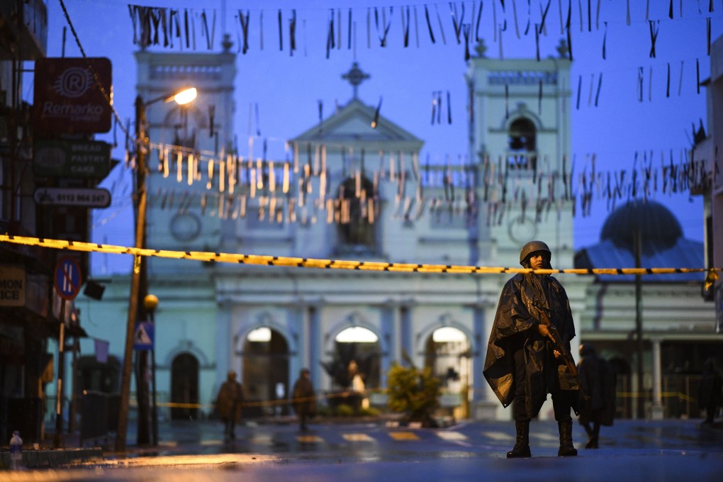 Sri Lankan soldiers stand guard in the rain at St Anthony’s Shrine in Colombo on Thursday. Photo: AFP