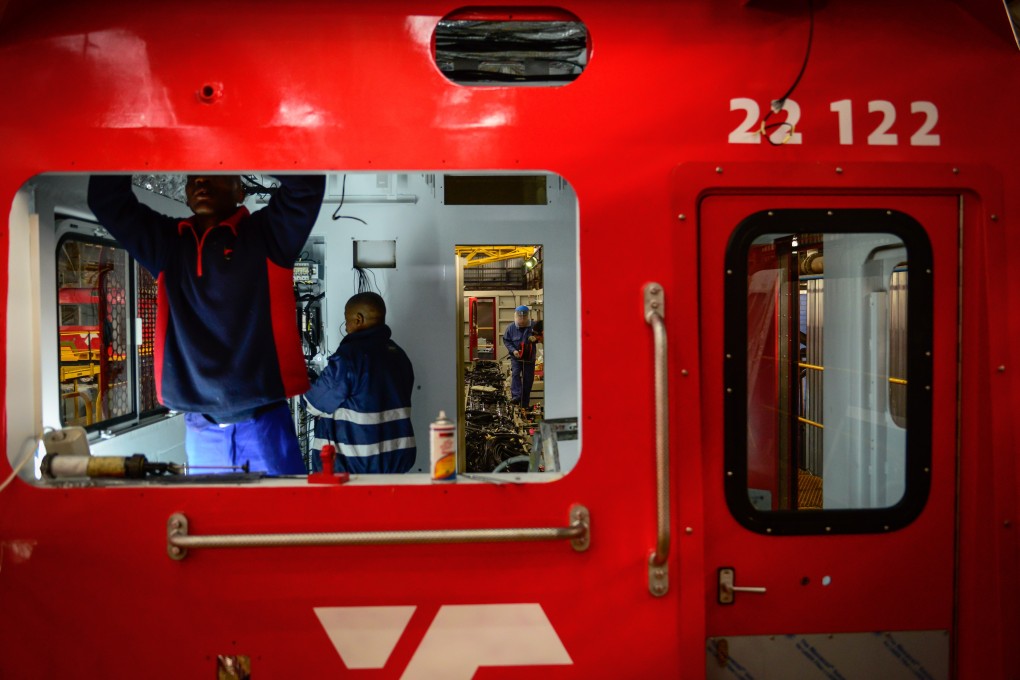 Chinese and South African technicians work on a train being built at the Transnet Engineering Koedoespoort Plant in Pretoria, South Africa in July 2017. Photo: Xinhua