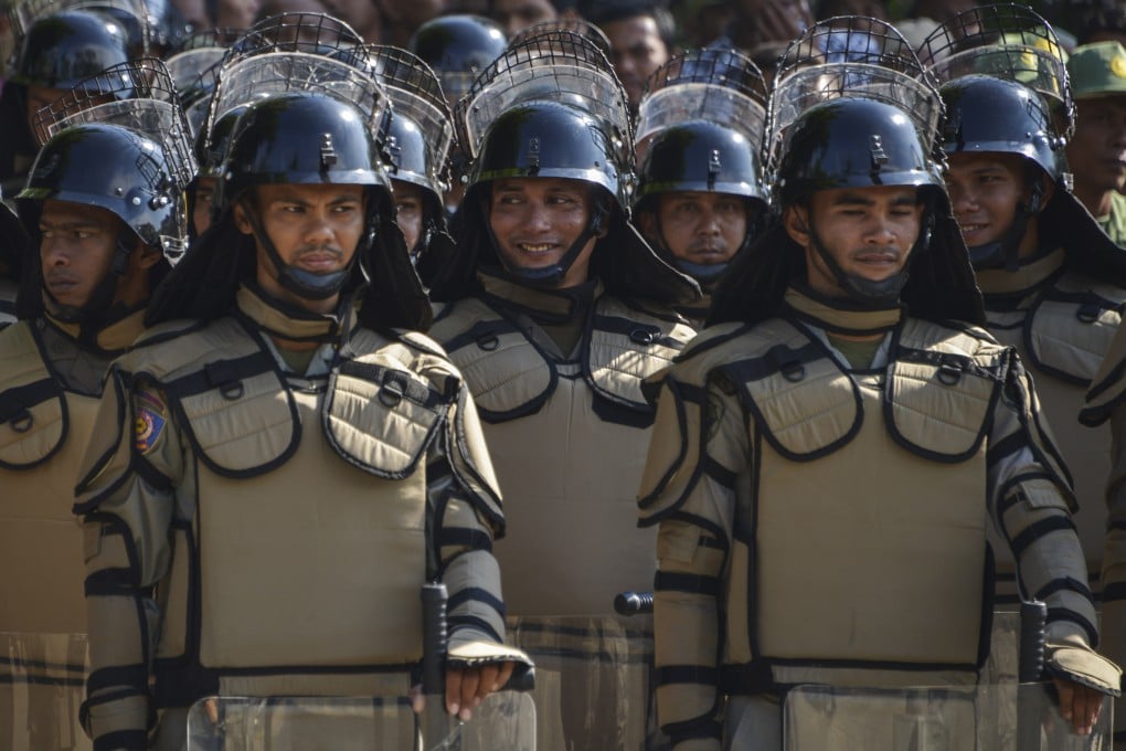 Indonesian Public Order Agency officers don riot gear for a security roll-call in Banda Aceh on April 11. Photo: AFP