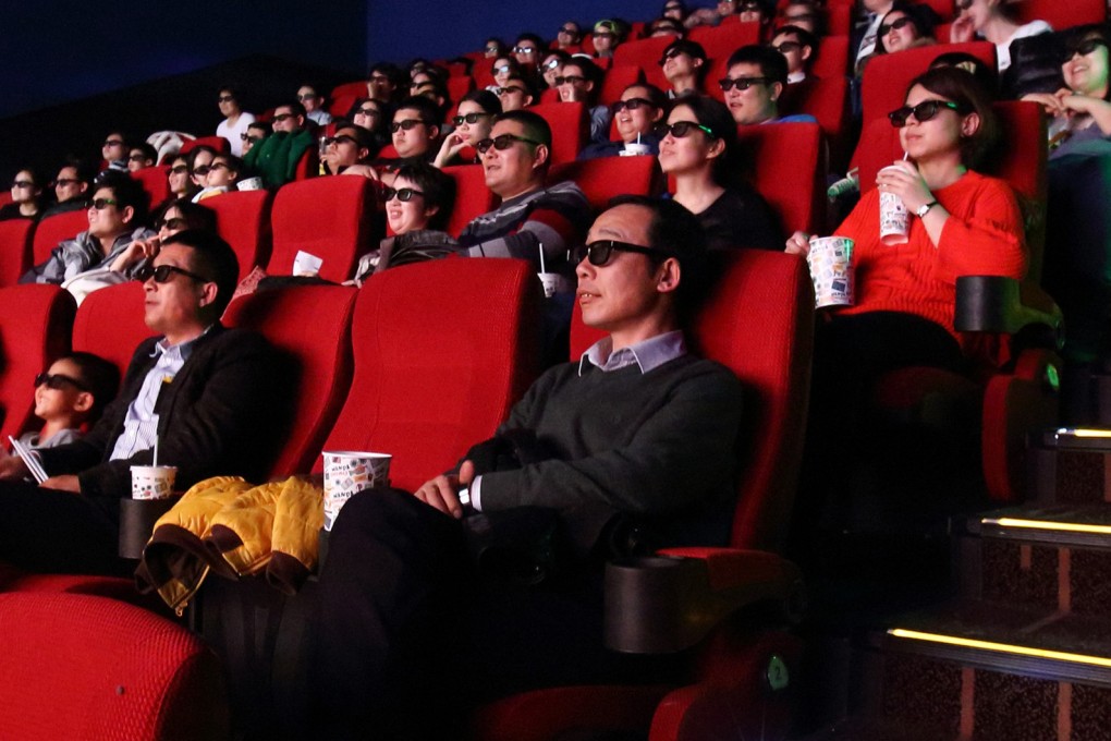 Movie goers with 3-D glasses in a cinema at the Tongzhou Wanda Plaza shopping mall, operated by Dalian Wanda Group, in Beijing on Saturday, March 14, 2015. Photo: Bloomberg