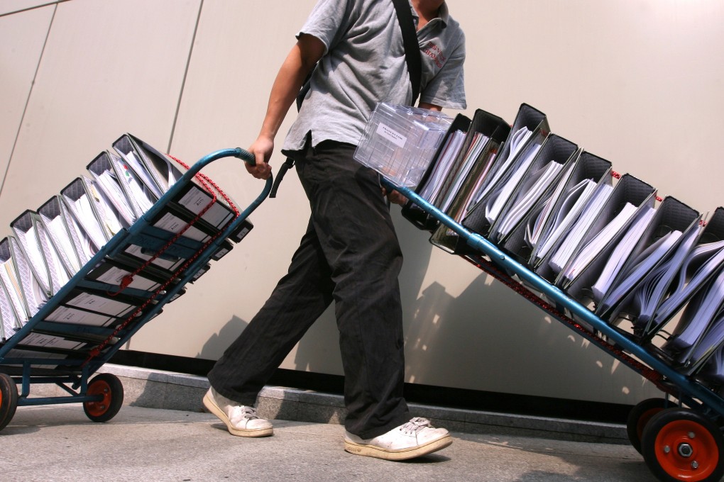 A courier deliver documents to Hong Kong’s High Court. Photo: Ricky Chung