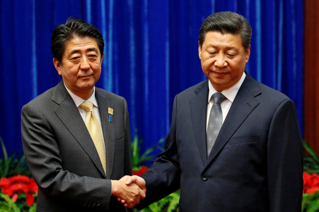 China's President Xi Jinping (R) with Japan's Prime Minister Shinzo Abe at the Great Hall of the People in Beijing on November 10, 2014 on the sidelines of the Asia-Pacific Economic Cooperation (Apec) meetings. Photo: Reuters