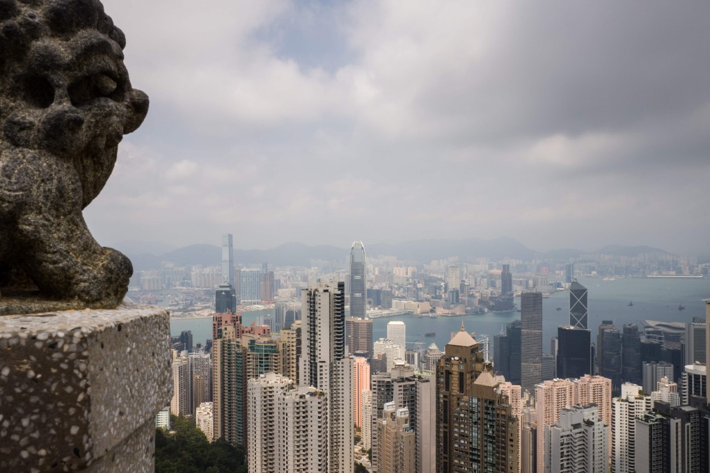 A general view taken from Victoria Peak shows residential and commercial buildings in Hong Kong on September 27, 2018. – Two of Hong Kong's biggest banks raised their lending rates on September 27 for the first time in 12 years, ending an age of cheap cash that could hit the city's famously red-hot property market. (Photo by Anthony WALLACE / AFP)