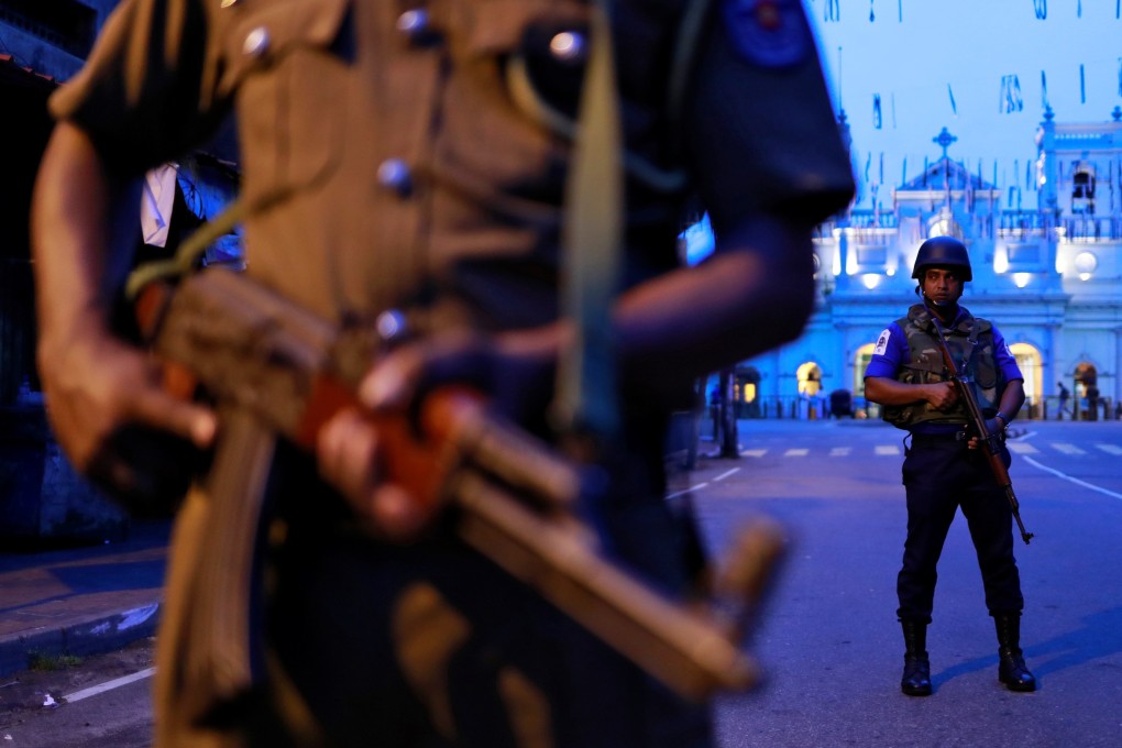 Security personnel stand guard in front of St Anthony’s Shrine in Colombo. Photo: Reuters