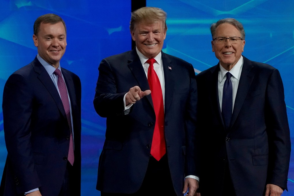 US President Donald Trump flanked by the National Rifle Association’s executive vice-president, Chris Cox (left), and its chief executive, Wayne LaPierre (right). Photo: Reuters