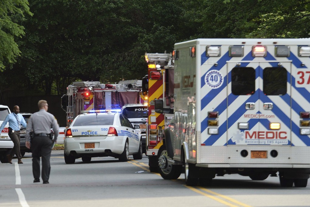 Emergency vehicles cluster on Mary Alexander Road on the campus of University of North Carolina at Charlotte after a shooting. Photo: AP