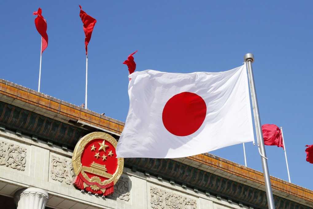 The Japanese flag flies at the Great Hall of the People in Beijing on October to mark the visit of Japanese Prime Minister Shinzo Abe to China. Photo: Kyodo