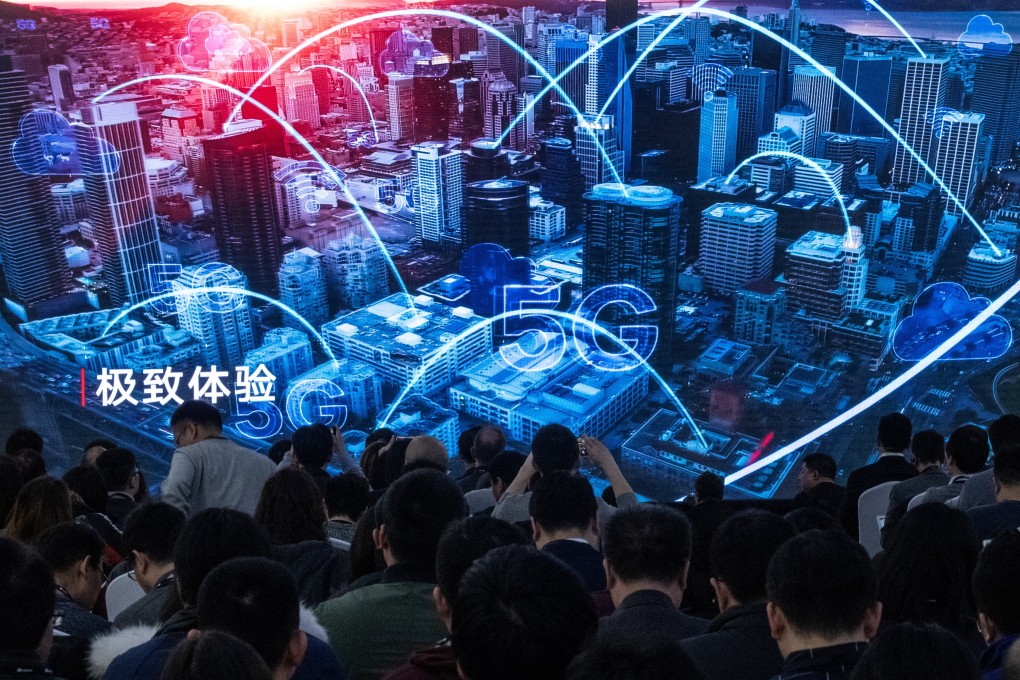 Journalists and guests watch a trailer during the press conference for the launch of Huawei Technologies’ new 5G products at the company’s Executive Briefing Centre in Beijing on January 24, 2019. Photo: Agence France-Presse