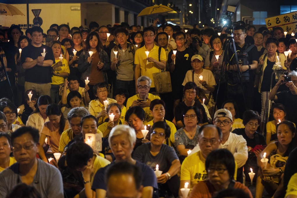 A candlelight vigil in support of the jailed members of the so-called “Umbrella Nine” democracy activists, at the Lai Chi Kok Reception Centre in Hong Kong, on April 24, 2019. Photo: Bloomberg