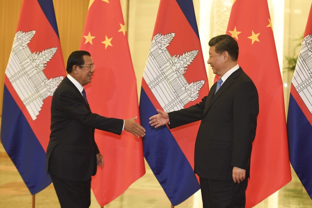 Cambodia’s Prime Minister Hun Sen shakes hands with Chinese President Xi Jinping before their meeting at the Great Hall of the People in Beijing last month. Photo: AP