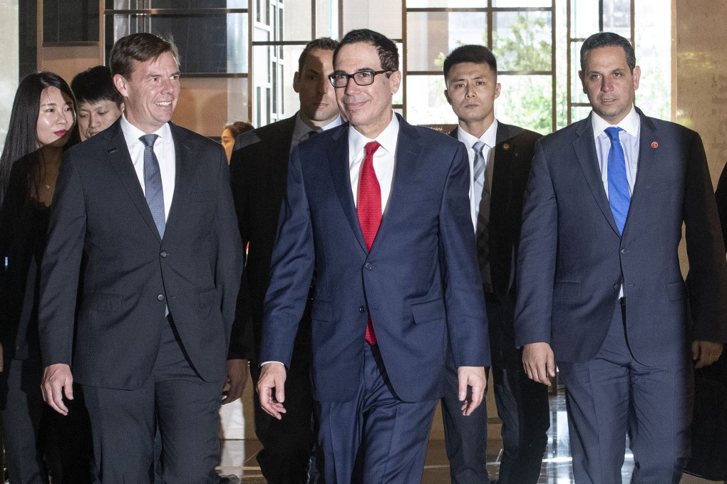 US Treasury Secretary Steven Mnuchin (centre) arrives at a hotel in Beijing, on Tuesday. Photo: Bloomberg