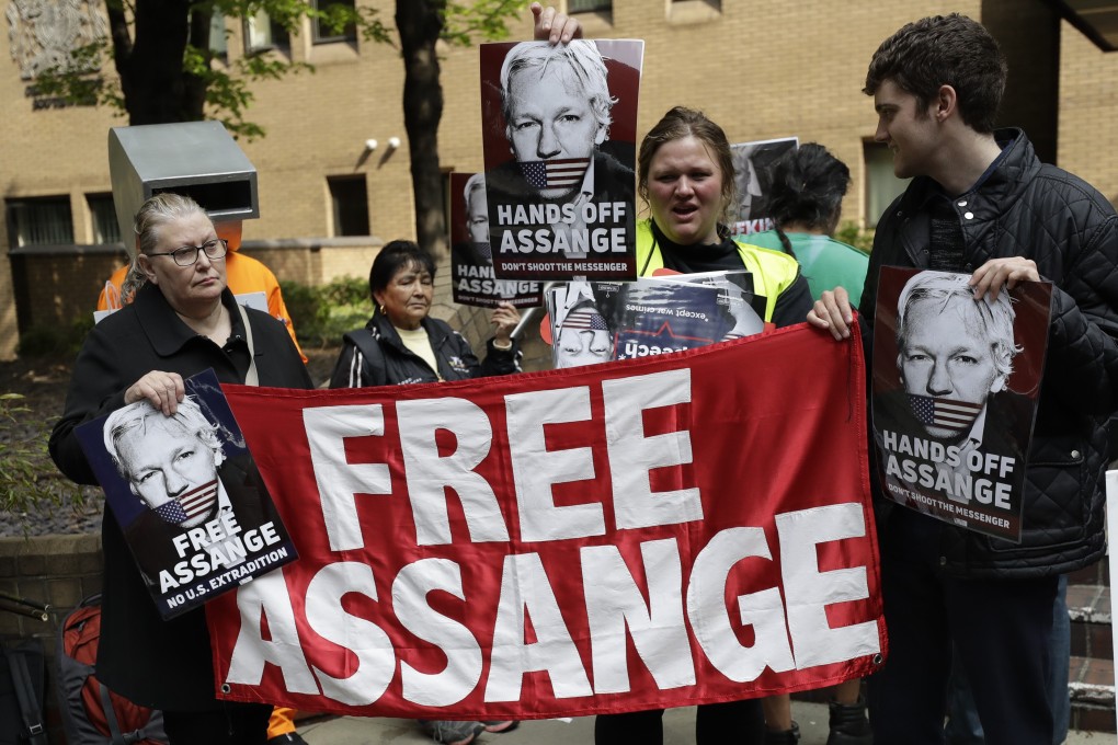 Protesters outside a London court as Julian Assange was sentenced to 50 weeks jail on charges of jumping British bail seven years ago. Photo: AP