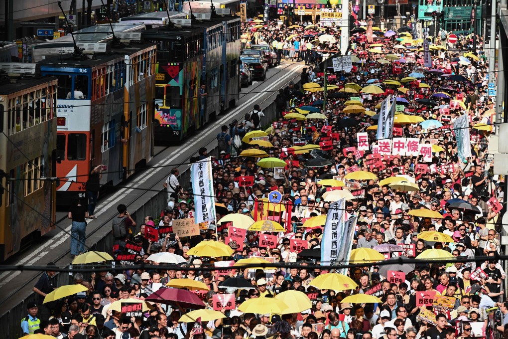 Activists attend a protest in Hong Kong on April 28 against a controversial move by the government to allow extraditions to mainland China. Photo: AFP