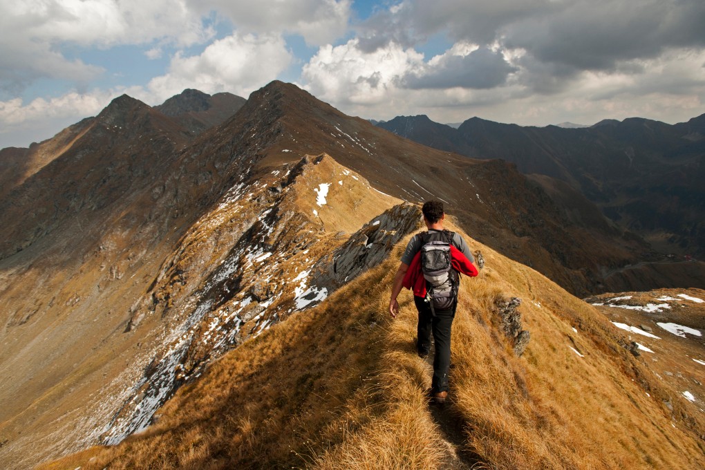 Hiking the Carpathian Mountains, in Transylvania, Romania. Photo: Alamy