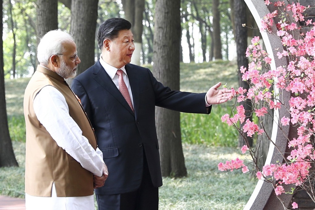 Indian Prime Minister Narendra Modi, left, and Chinese President Xi Jinping talk in Wuhan in April last year. Photo: Xinhua