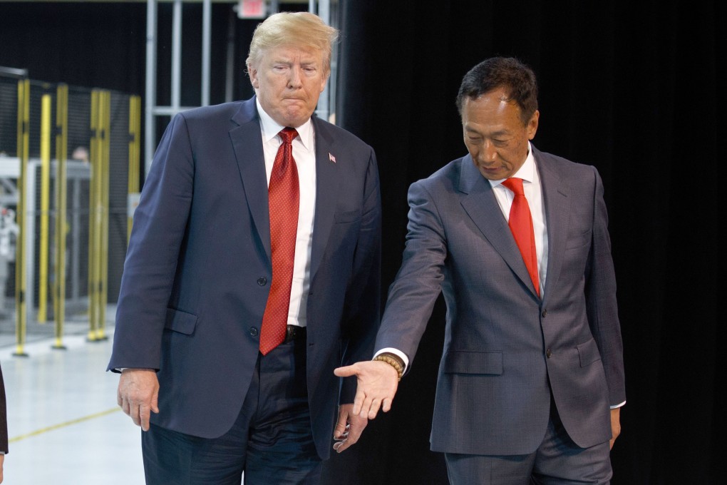 US President Donald Trump views the plans for Foxconn’s Wisconsin plant with the firm’s boss, Terry Guo, last year. Photo: AP