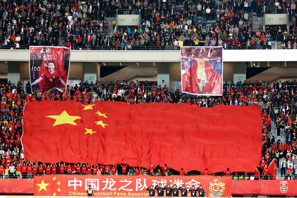 Chinese fans cheer for the national team during a match against India in 2018. Photo: AFP
