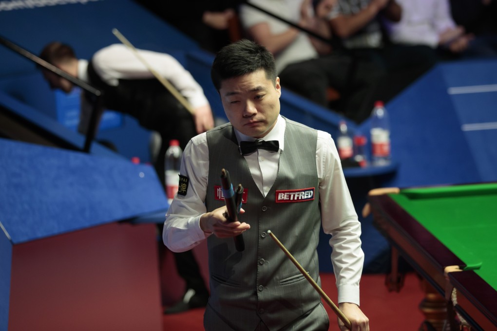 Ding Junhui of China leaves after losing to Judd Trump in the World Snooker Championship at the Crucible. Photo: Xinhua