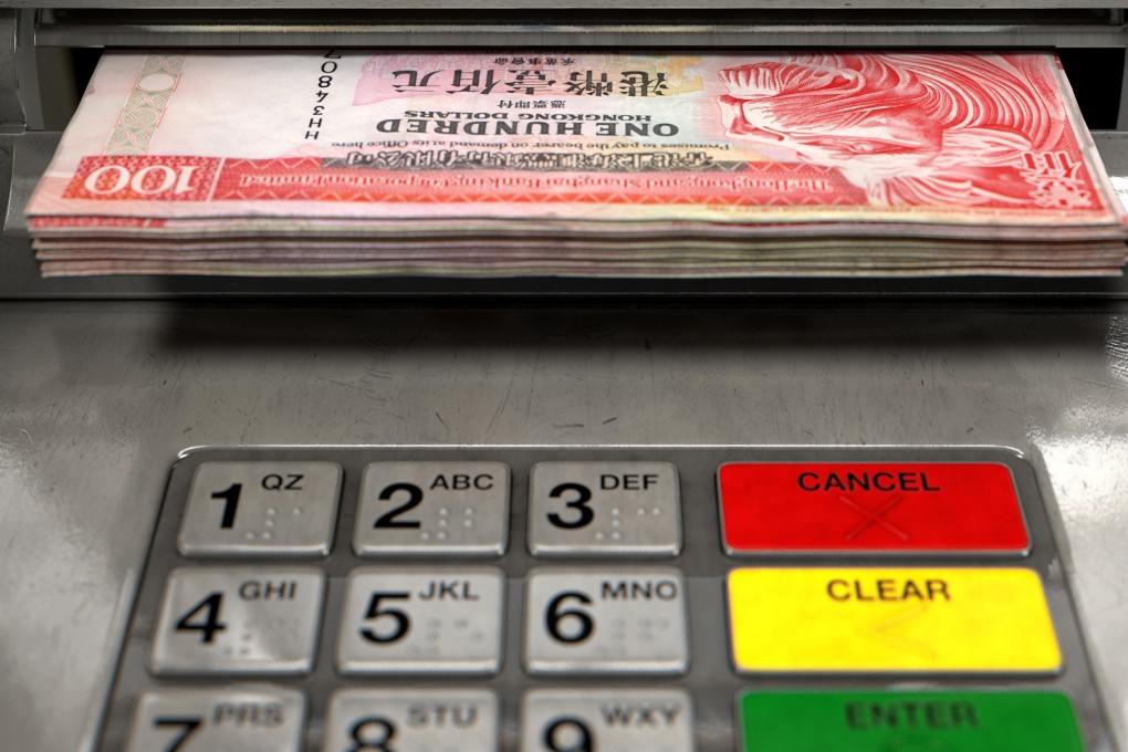 An ATM in Tsim Sha Tsui East MTR station malfunctioned and staff found an illegal card reader inserted in the slot. Photo: Alamy