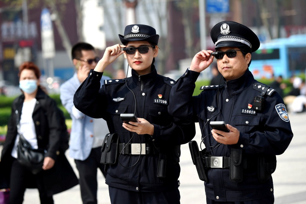 Police officers display their artificial intelligence-powered smart glasses in Luoyang, a city in central China’s Henan province, on April 3, 2018. Photo: Reuters