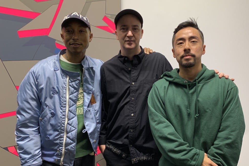 Singer Pharrell Williams (left) and collector Kevin Poon (right) with Brian Donnelly, also known as artist Kaws. Photo: Kevin Poon