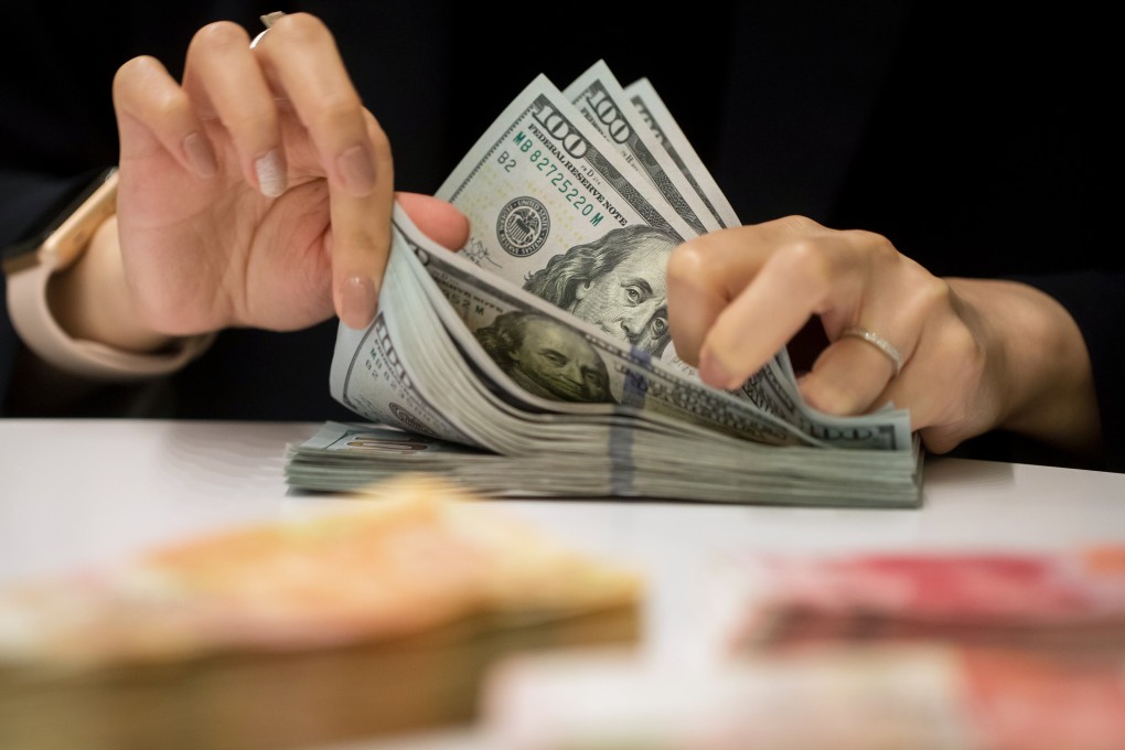 The change means a withdrawal of US$3,000 or more in a single transaction requires proof of need, such as an airline ticket for overseas travel, or a health certificate. Photo: Bloomberg