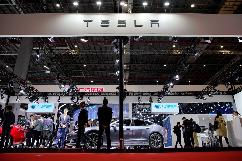 People visit a Tesla booth at the Auto Shanghai motor show on April 16. Photo: Reuters