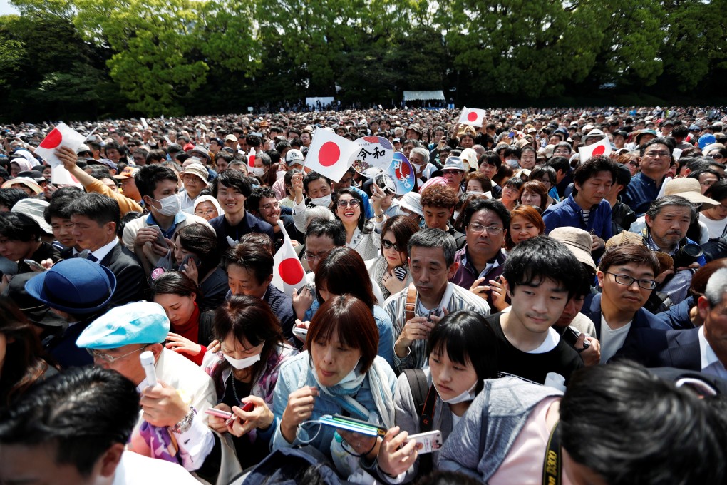 Well-wishers at the Imperial Palace in Tokyo on Saturday. Photo: Reuters