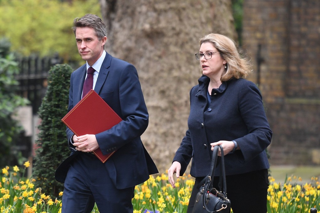 Britain's former defence secretary Gavin Williamson (L) and Britain's International Development Secretary and Minister for Women and Equalities Penny Mordaunt arrive in Downing street in central London. Photo: AFP