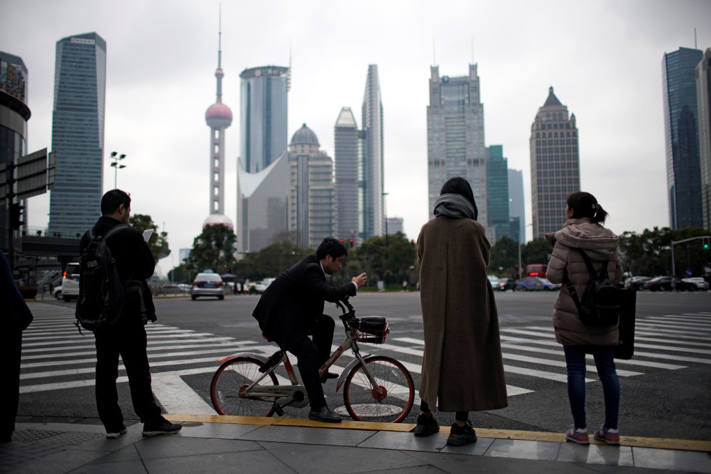 Pedestrians at a crossing at the Lujiazui financial district in Pudong, Shanghai on March 14, 2019. Photo: REUTERS