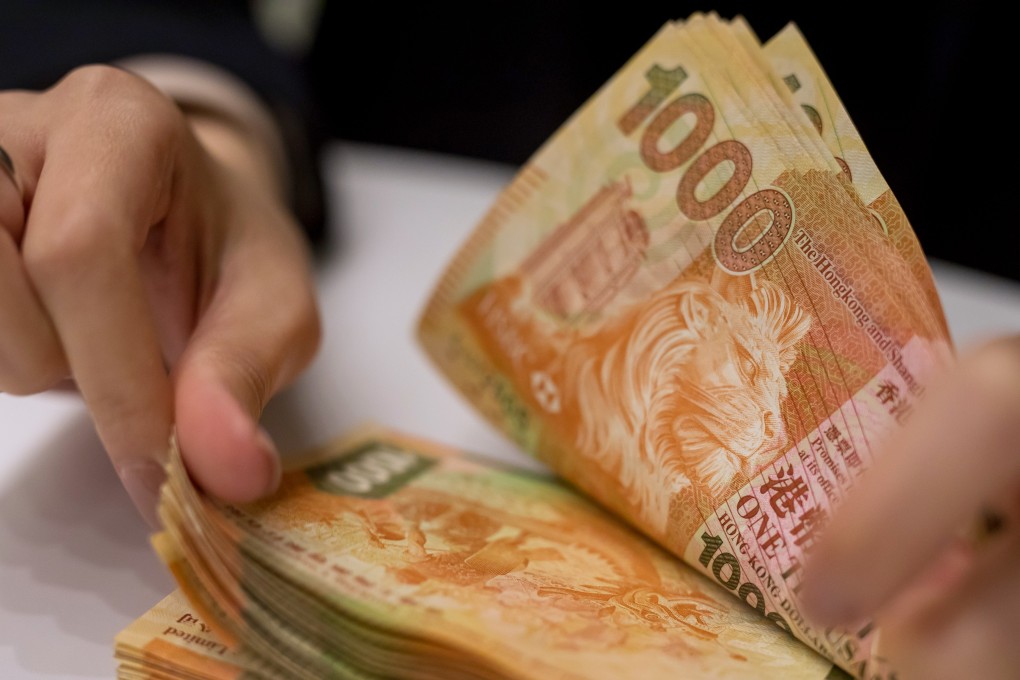 HK$1,000 notes being counted at a bank in Hong Kong. Photo: Bloomberg