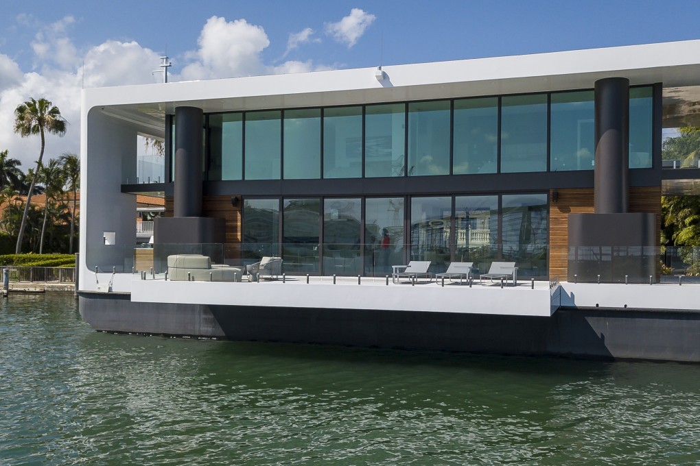 The Arkup houseboat, a green-energy luxury floating home that can adapt to sea rise, as it docks off Palm Island near Miami Beach on Saturday, April 27, 2019. The floating house has solar panels, impact resistant windows and can withstand hurricane winds of up to 155 miles per hour. Photo: Miami Herald