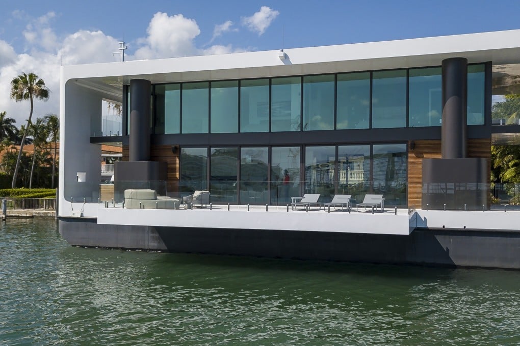 The Arkup houseboat, a green-energy luxury floating home that can adapt to sea rise, as it docks off Palm Island near Miami Beach on Saturday, April 27, 2019. The floating house has solar panels, impact resistant windows and can withstand hurricane winds of up to 155 miles per hour. Photo: Miami Herald