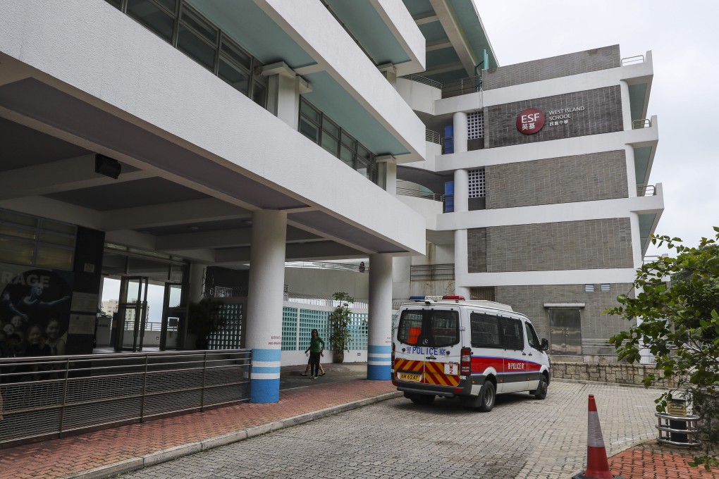 Police investigate a case at West Island School in Pok Fu Lam after a teacher threatened to jump from the roof. Photo: Edmond So